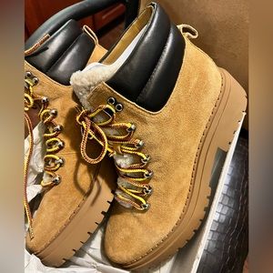 Nairy Lace-Up Genuine Leather Shearling Lug Sole Bootie.